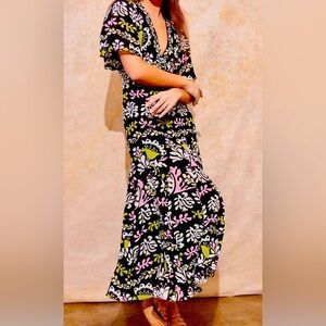 V-neck featuring short flowy sleeves, empire waistline,long tiered ruffle skirt